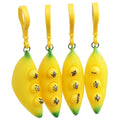 Yellow banana squeeze toy keychains with green tips, icons and name label, loop rings