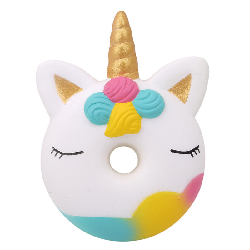 Unicorn squishy toy ring with horn, flower mane, and circular hole