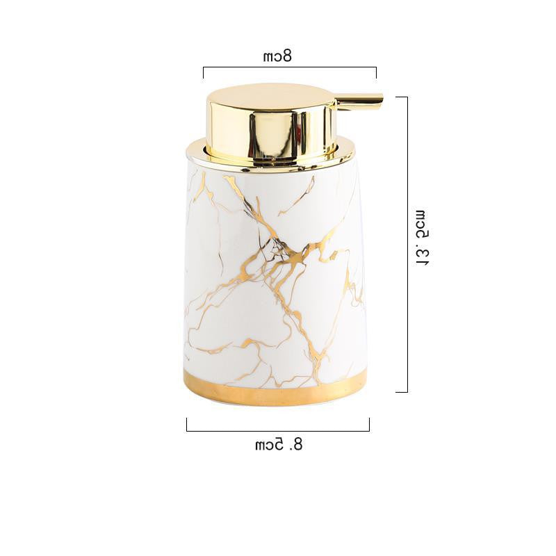 White ceramic foam soap dispenser with gold pump top and marble vein pattern