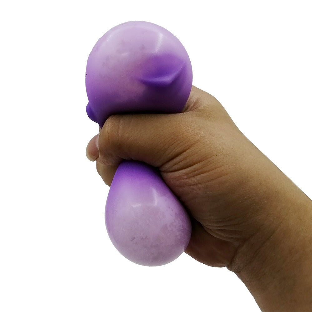 Purple cat-shaped stress relief venting ball squeezed in a hand