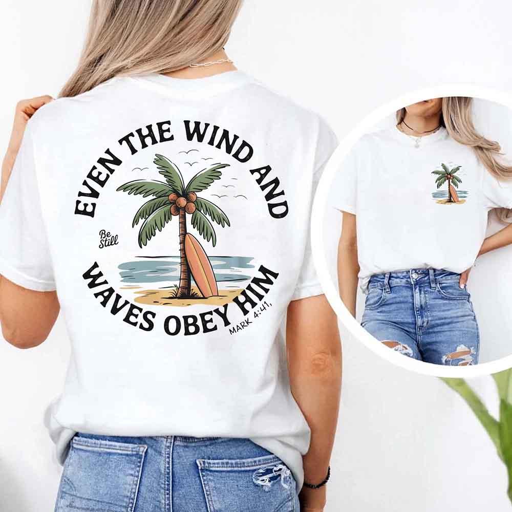 White unisex tee with large back verse text "Even the Wind..." and palm tree graphic