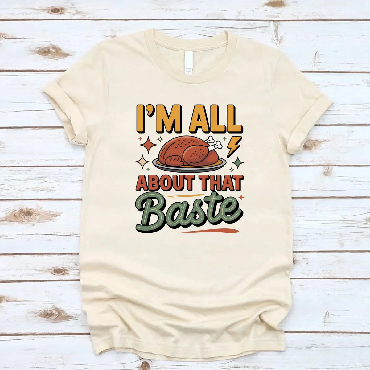 Cream T-shirt with turkey gravy graphic reading “I’m all about that Baste”.
