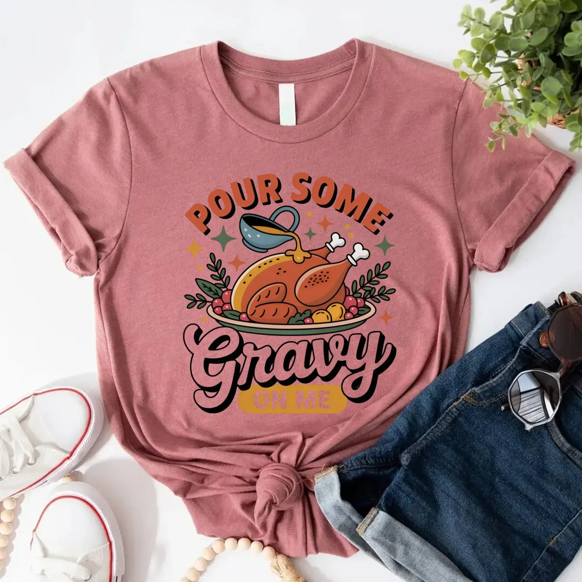 Funny Thanksgiving t-shirt in mauve with “Pour some Gravy on me” turkey graphic
