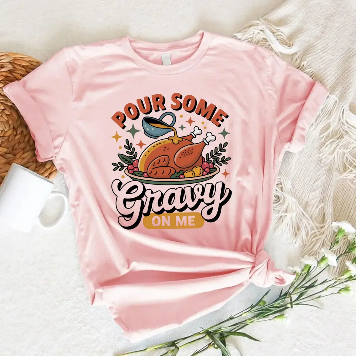 Light pink Thanksgiving T-shirt with “Pour Some Gravy on Me” turkey graphic