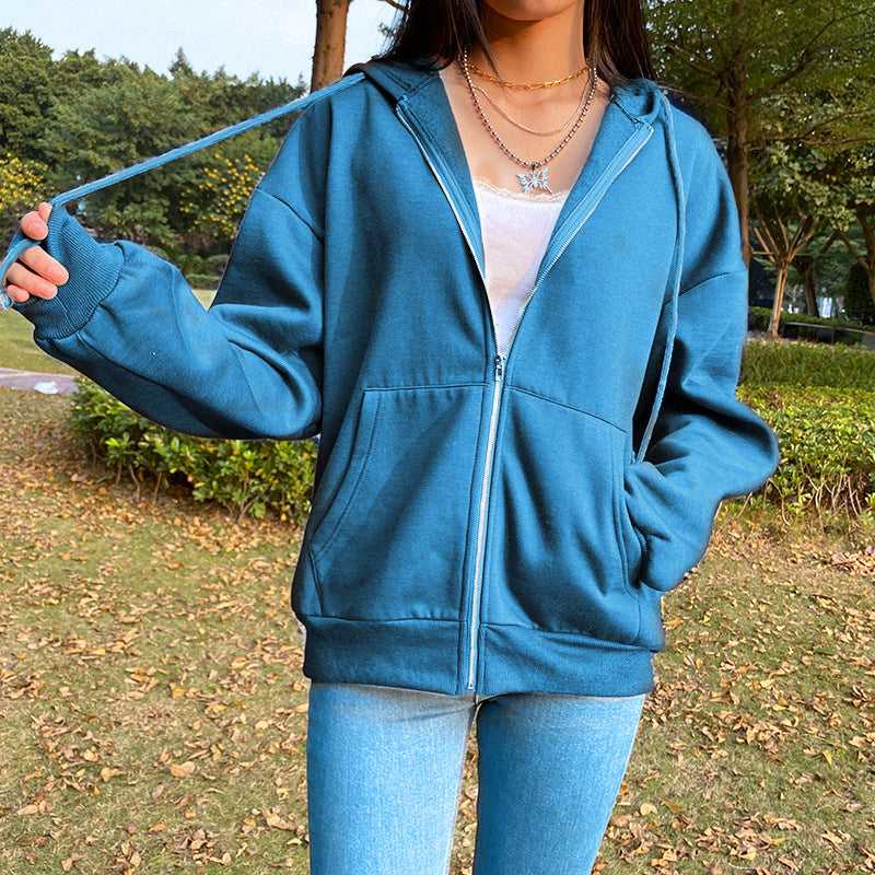 Women's hooded zip-front jacket in blue with front zipper, drawstring hood, and side pockets