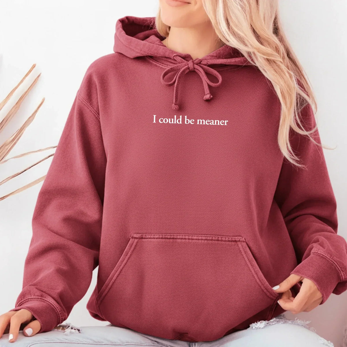 Crimson red hoodie sweatshirt with drawstring hood and front kangaroo pocket