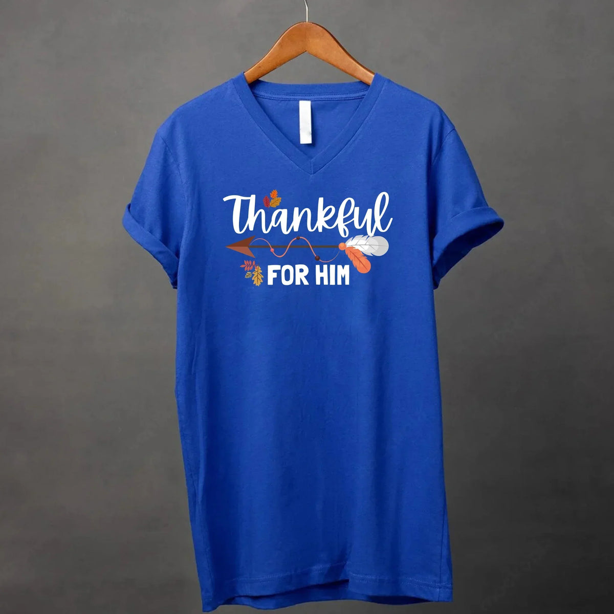 Royal blue v-neck T-shirt with white script 'Thankful for him' and autumn leaf print