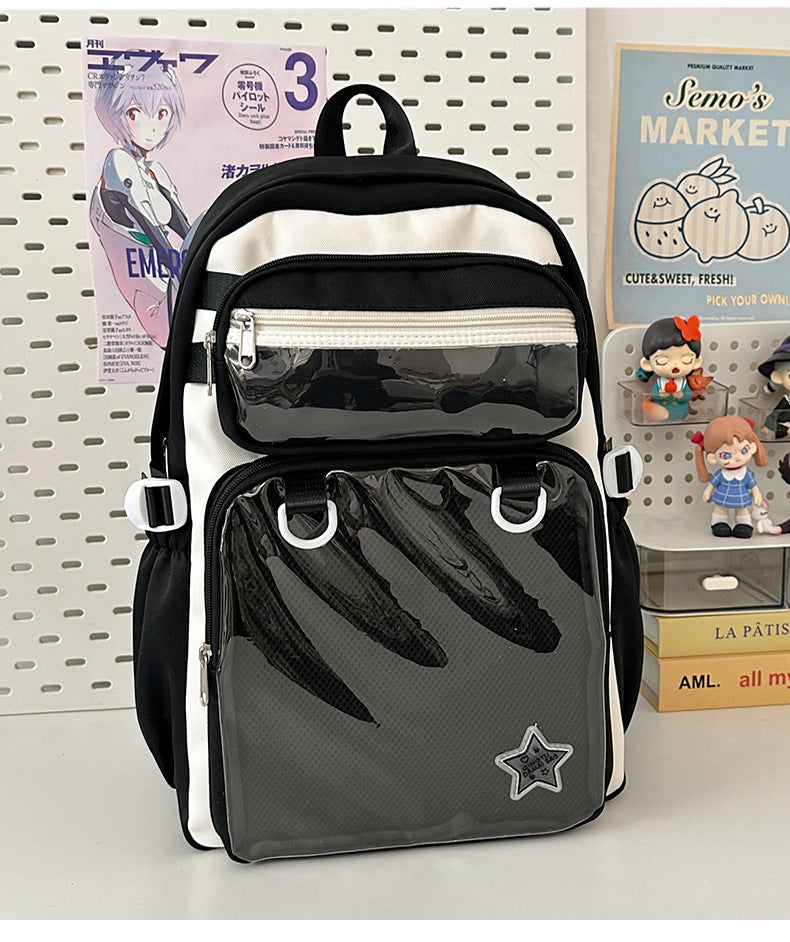 Black large capacity nylon backpack with front zip pocket, mesh panel, and star badge