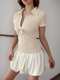 Apricot textured mini dress with collared V-neck, short sleeves, drawstring tie and white ruffle skirt