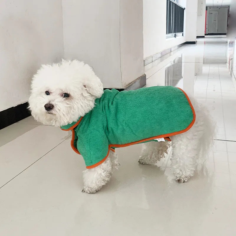 Green pet bathrobe towel on white dog, orange-edged neckline and leg openings