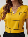 Yellow plaid short-sleeve blouse with notched V-neck and black grid pattern