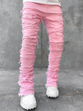 Men's pink ripped stacked jeans with frayed patch details and distressed cuffs