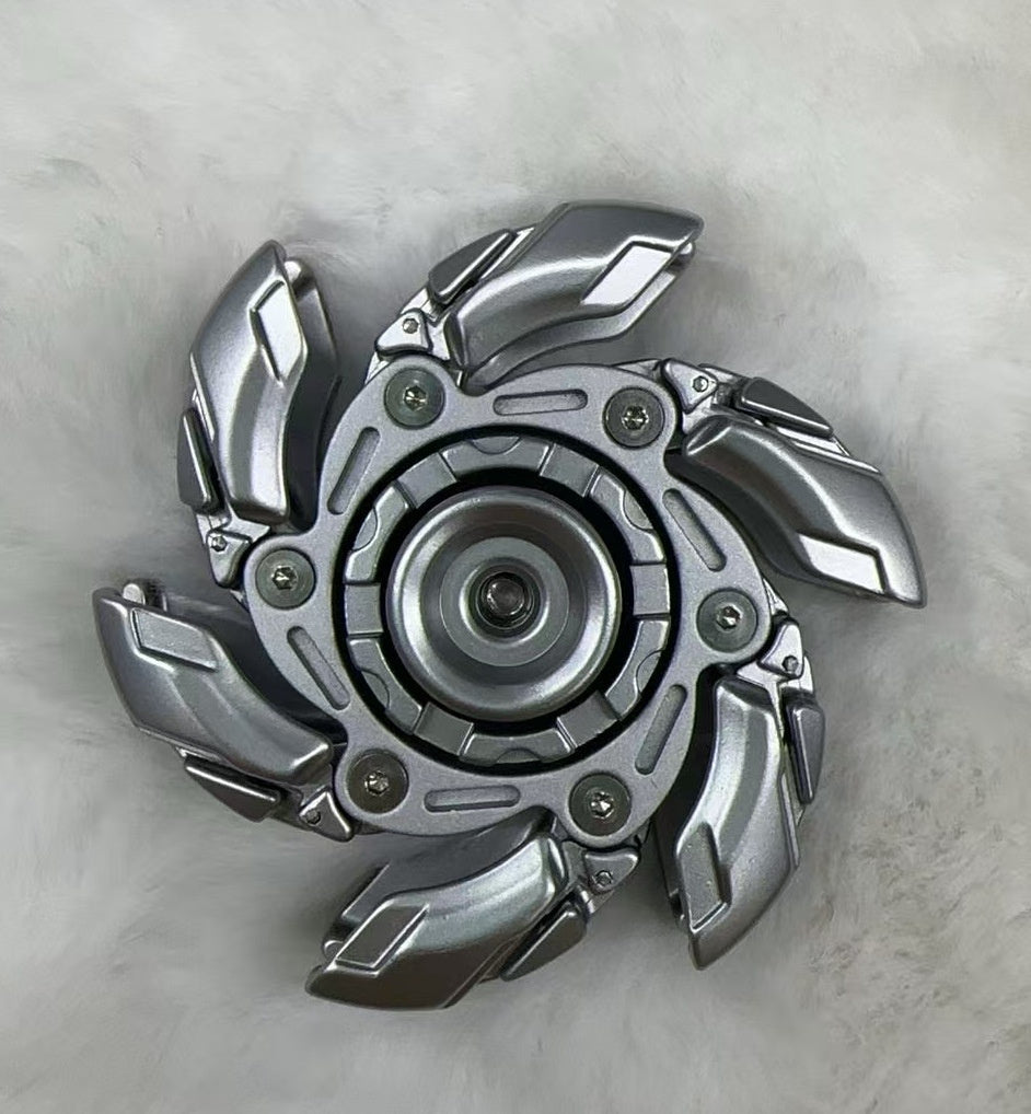 Silver rotating fingertip decompression gyro toy with metal claw blades and center hub