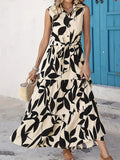 Sleeveless shirt dress in cream and black leaf print, tie waist and tiered ruffle skirt