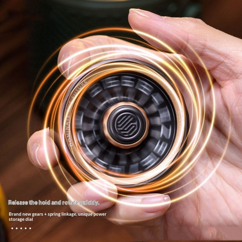 Metal rotating fidget spinner with bronze center ring and black segmented face