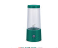 Portable mini juicer cup with teal base and clear ribbed blending chamber