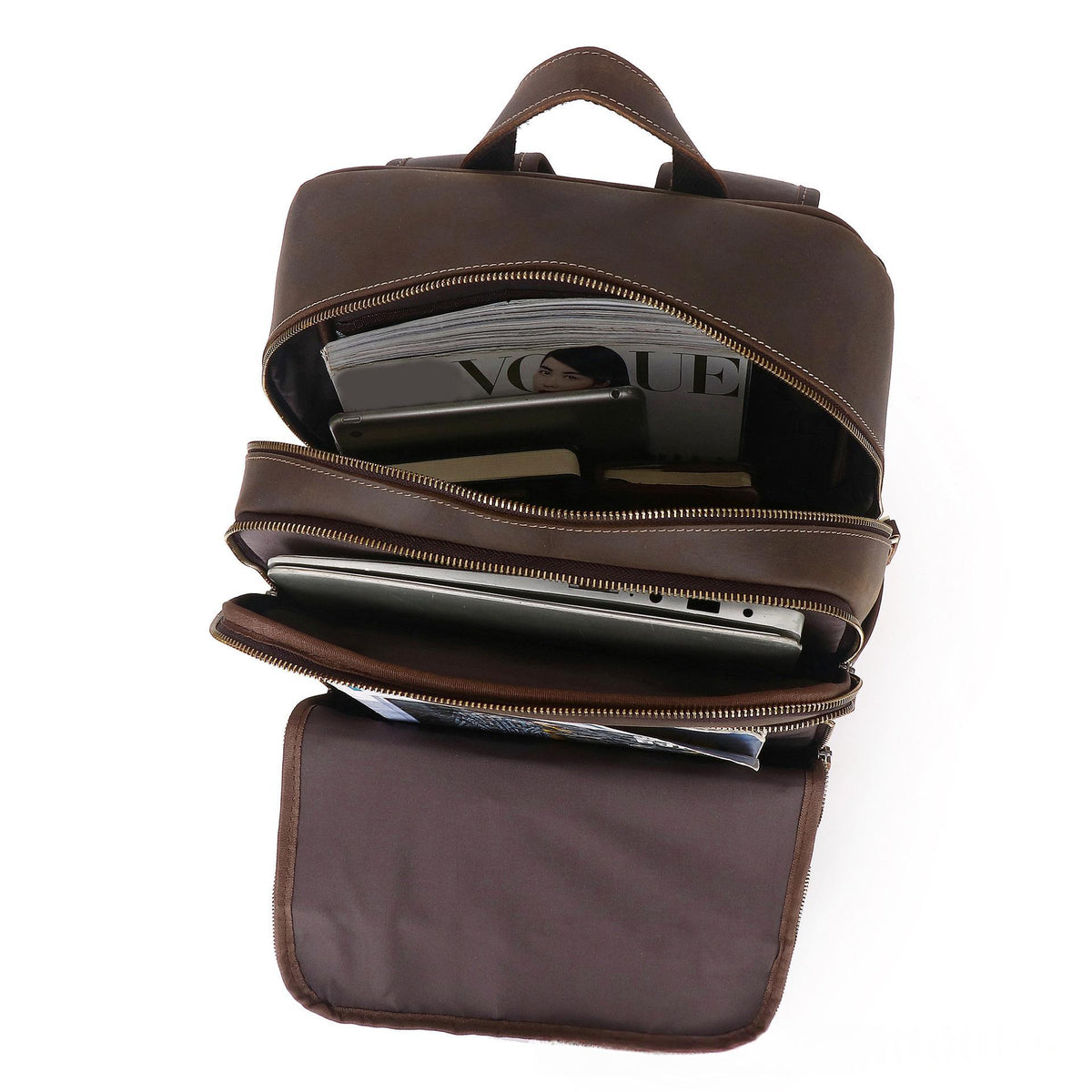 Coffee-brown leather backpack with open front compartments and multiple zip closures