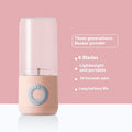 Pink portable mini wireless juicer cup with clear chamber and gray charging button