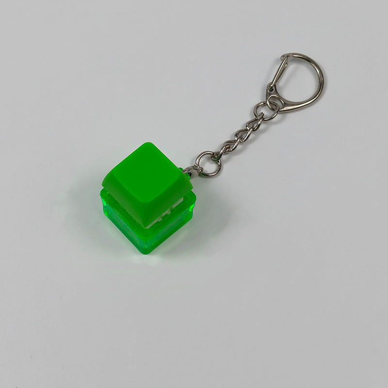 Green cube stress-relief keychain toy with finger-popping button and metal chain