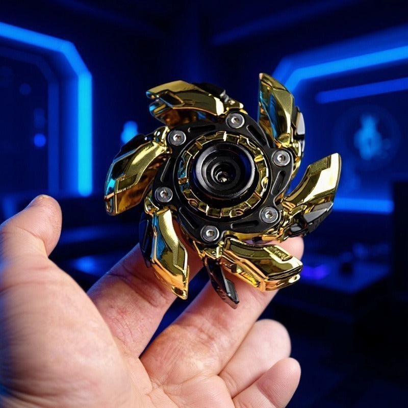 Close-up of black and gold fingertip gyro decompression toy with circular center and blades