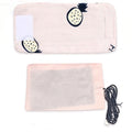 Pink striped bottle warmer sleeve laid out with heating pad and black USB cable