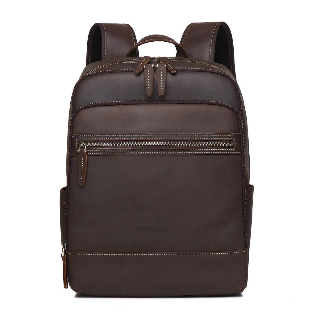 Coffee-brown leather backpack with top handle and central front zip pocket
