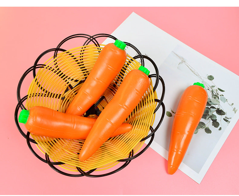 Orange carrot-shaped stress relief toys in a black wire basket with green caps