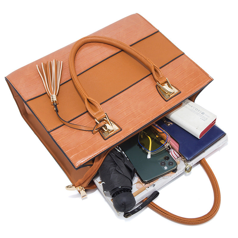 Crocodile-embossed PU handbag set in tan/orange, laid open with phone and cards