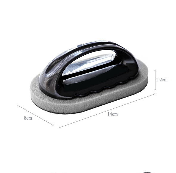 Black cleaning tool with curved handle on rectangular gray foam pad