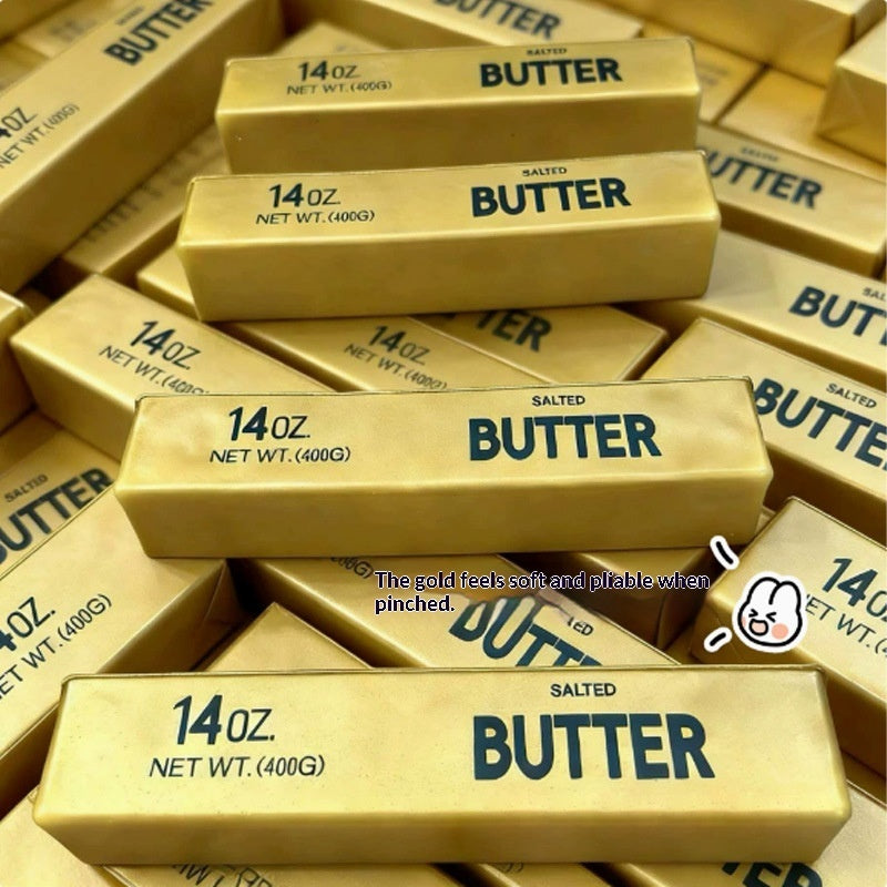 Gold “Butter” squishy stick toys, soft molded texture shown