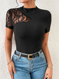 Black ribbed short-sleeve top with lace shoulder overlay and mock neck