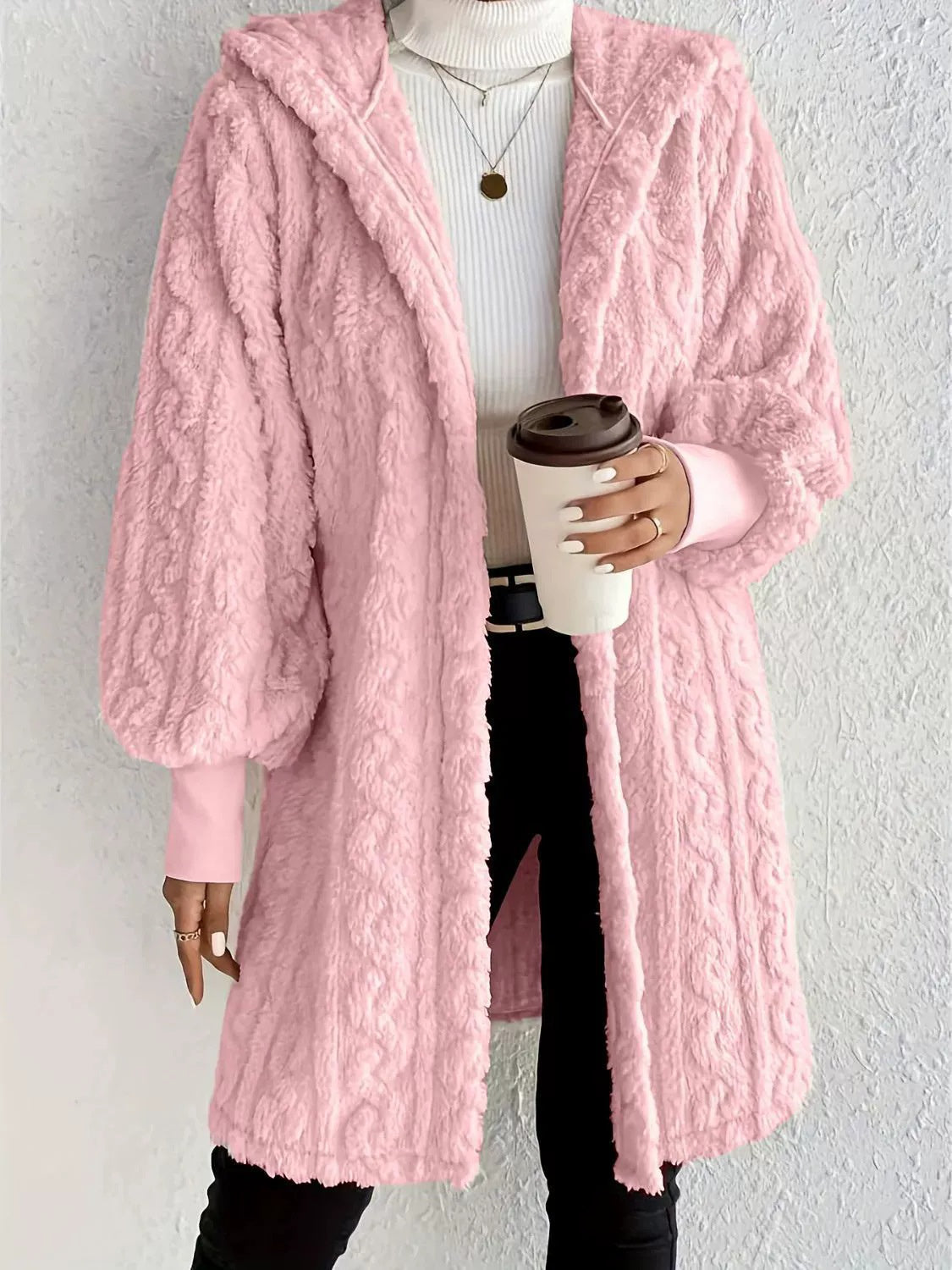Hooded long plush coat in pink, open front, soft textured fabric and hood.