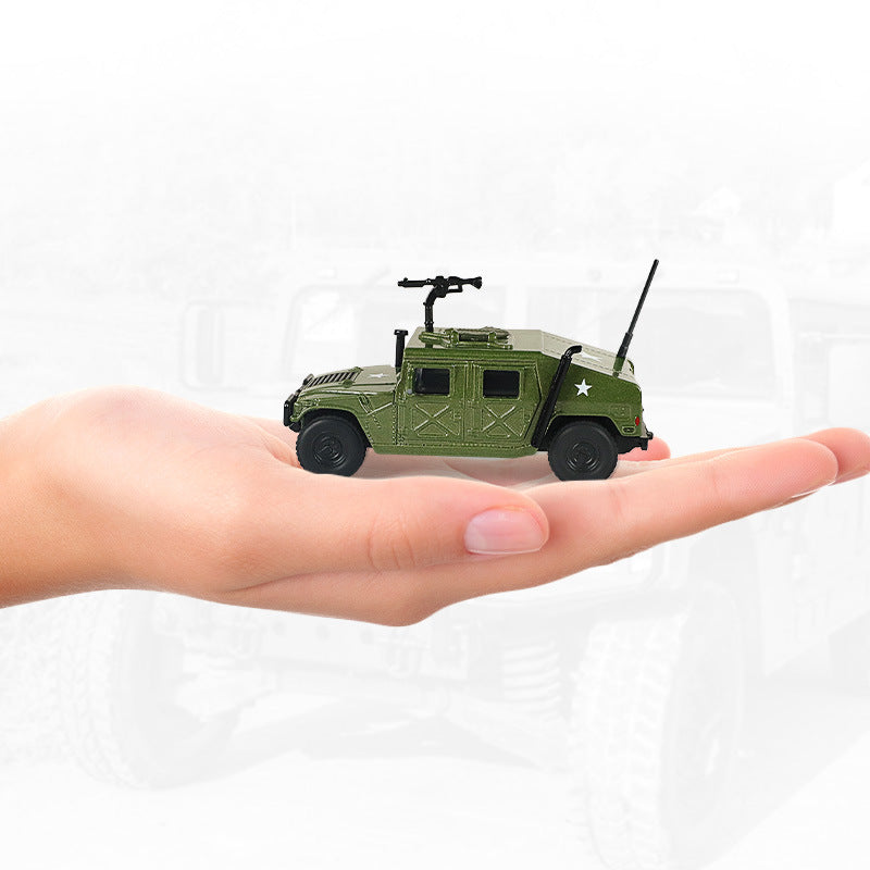 Green alloy military model toy held in hand, showing turret and antenna