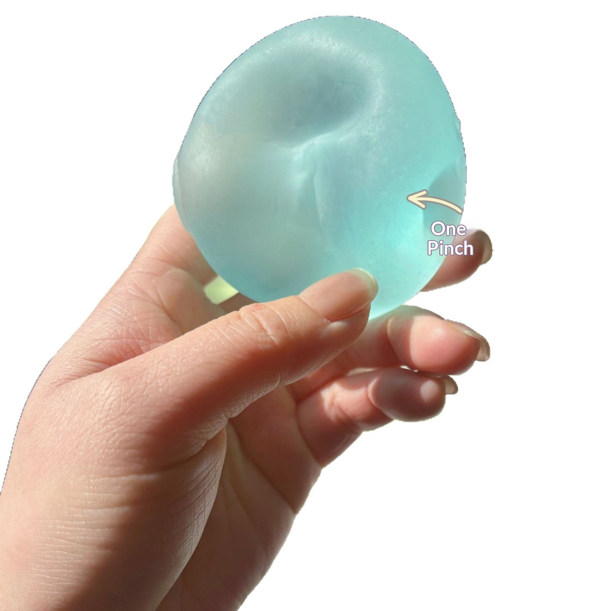 Translucent round squishy candy squeeze toy, light blue, pinched texture