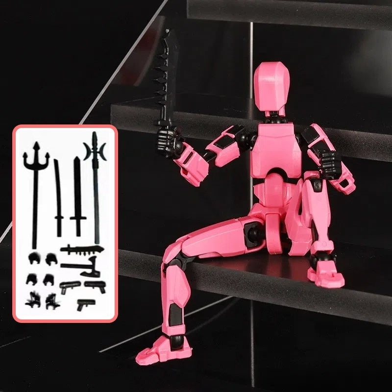 Pink articulated robot action figure with black rifle accessory and parts card