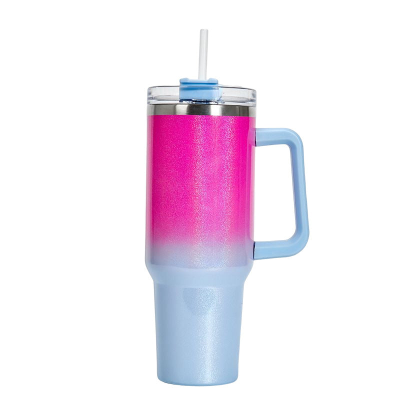 Insulated stainless steel tumbler with magenta-to-light-blue gradient finish, handle, clear lid