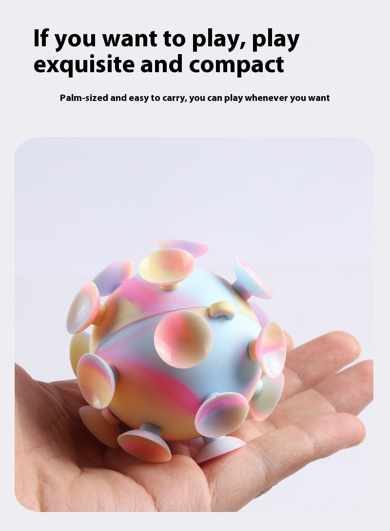 Palm-sized pastel rainbow silicone stress ball with suction-cup lobes