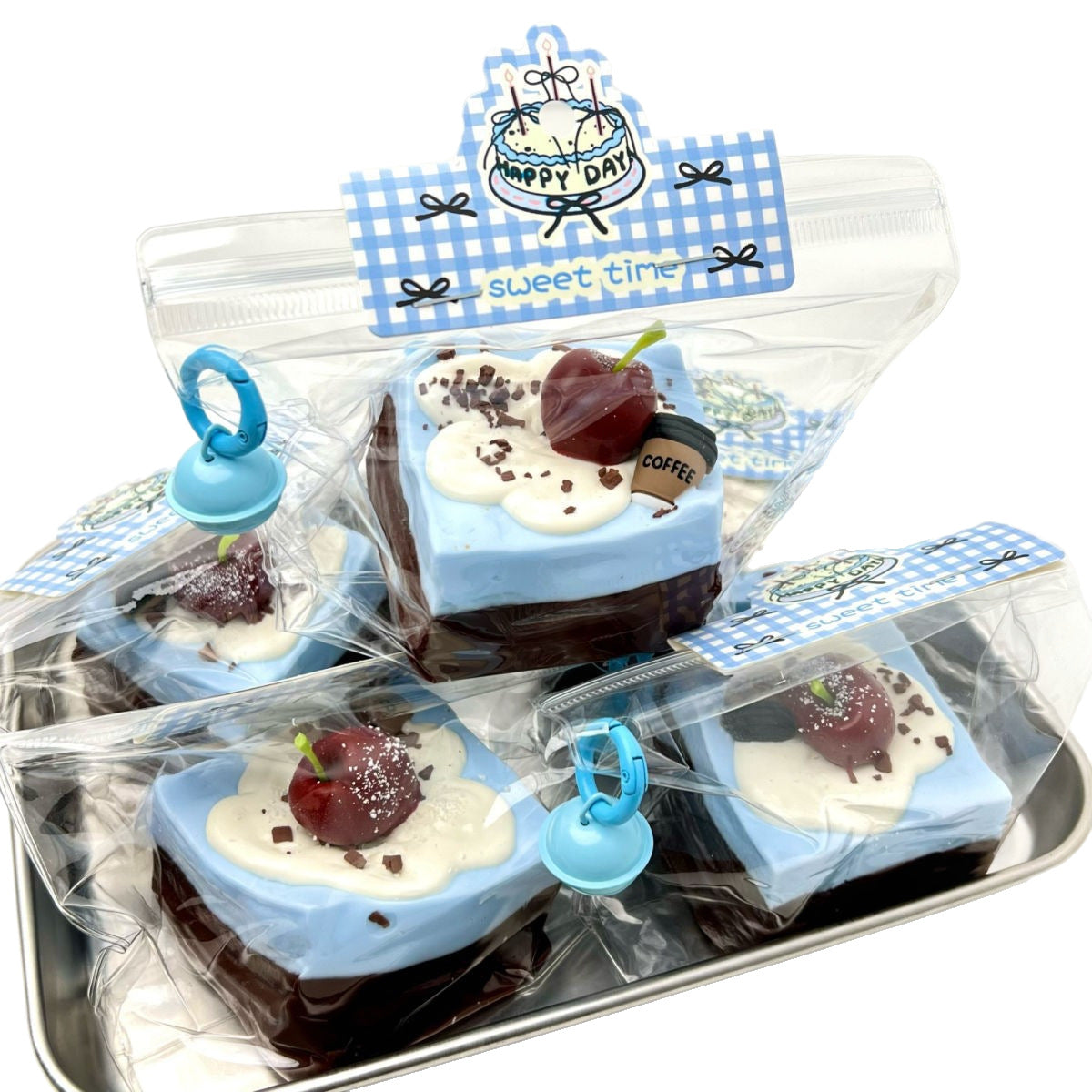 Assorted cake-slice stress-relief clay gadgets in clear bag, blue seal clips, layered colors