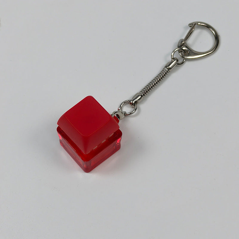 Red square finger-popping keychain toy with spring chain and snap buttons