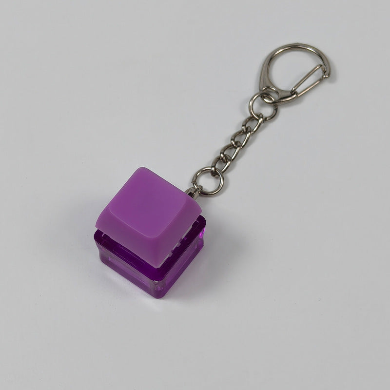 Purple square finger-popping stress-relief keychain toy with metal chain and rings