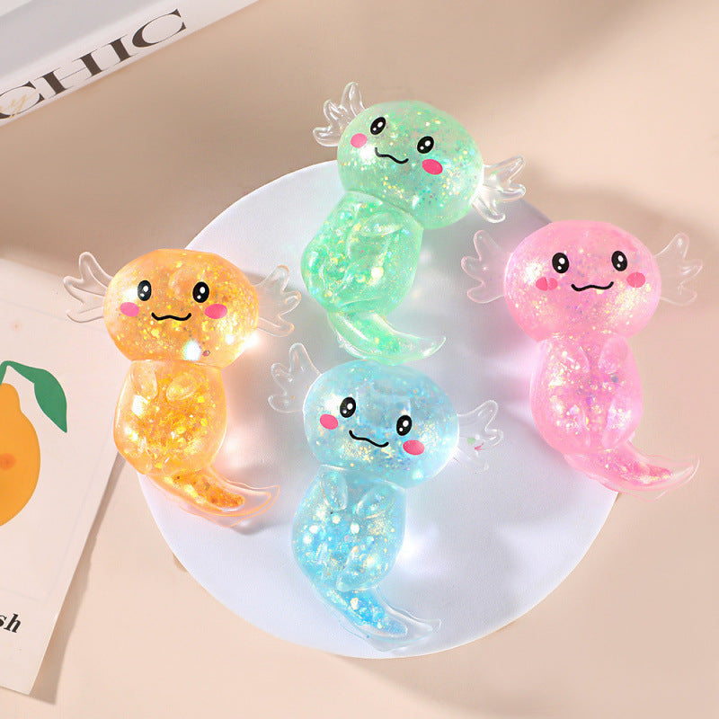 Four neon glitter slime salamander stress balls on a round white plate