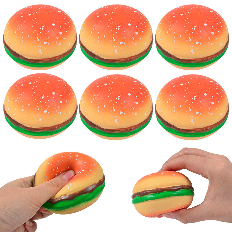 Assorted burger squishy stress relief balls with orange bun, green lettuce, and brown patty