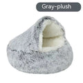 Gray plush semi-enclosed pet bed with cream-lined inner cushion and curved entrance