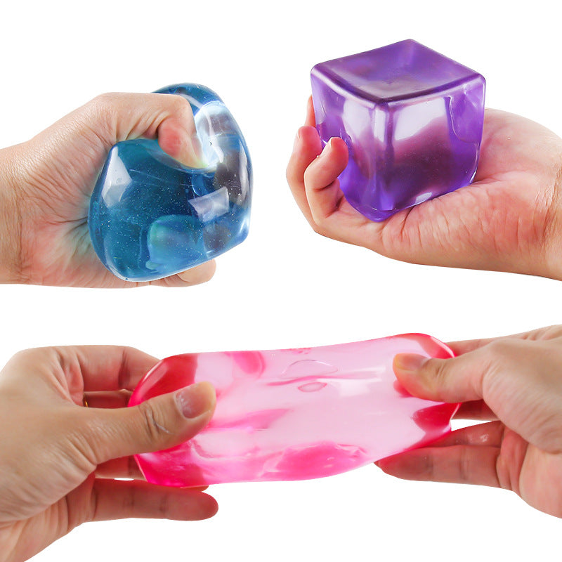Hands squeezing square fidget balls in blue, purple, and red