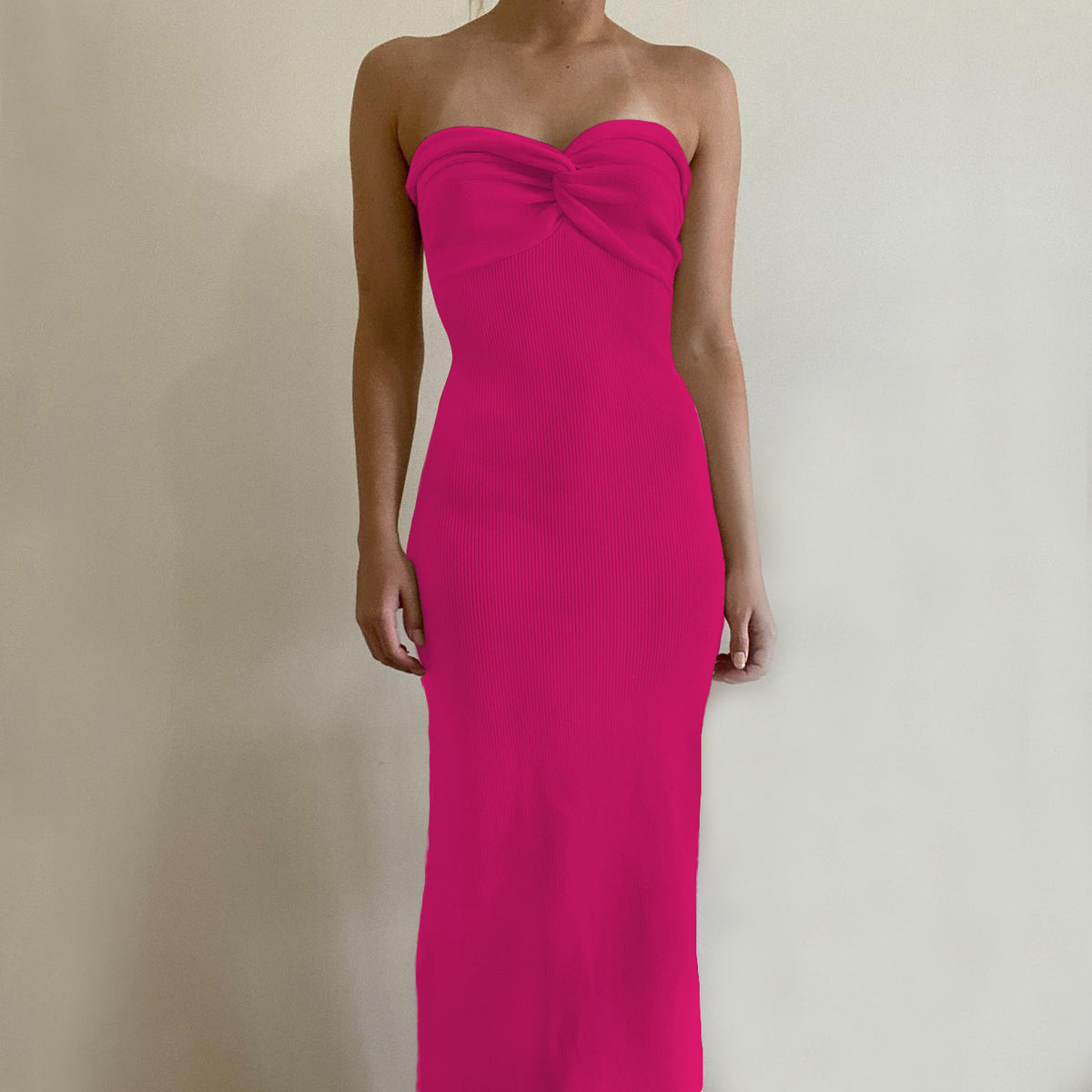Off-shoulder knit wrap dress in hot pink with knotted bust detail, long silhouette