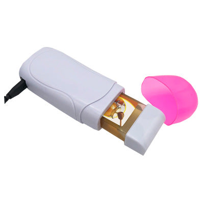Pink portable wax machine with open warming chamber and pink spatula tool