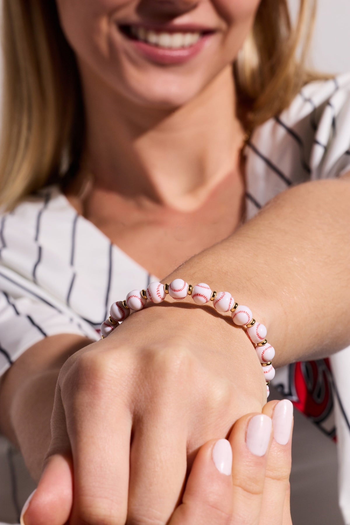 Baseball beaded bangle with white/red ball beads and gold spacer rings