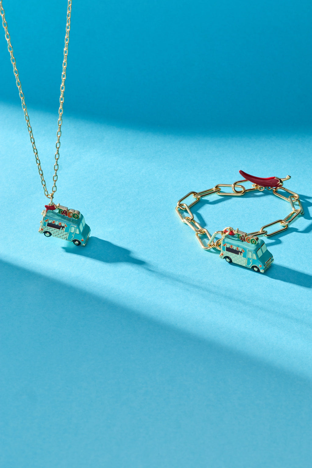 Gold taco truck locket necklace with taco truck pendant and matching chain links.
