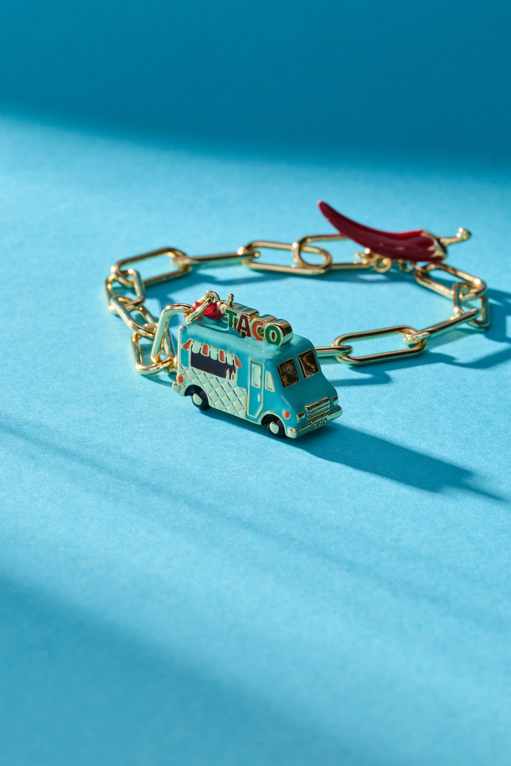 Gold taco truck toggle bracelet with red chili charm and linked frame