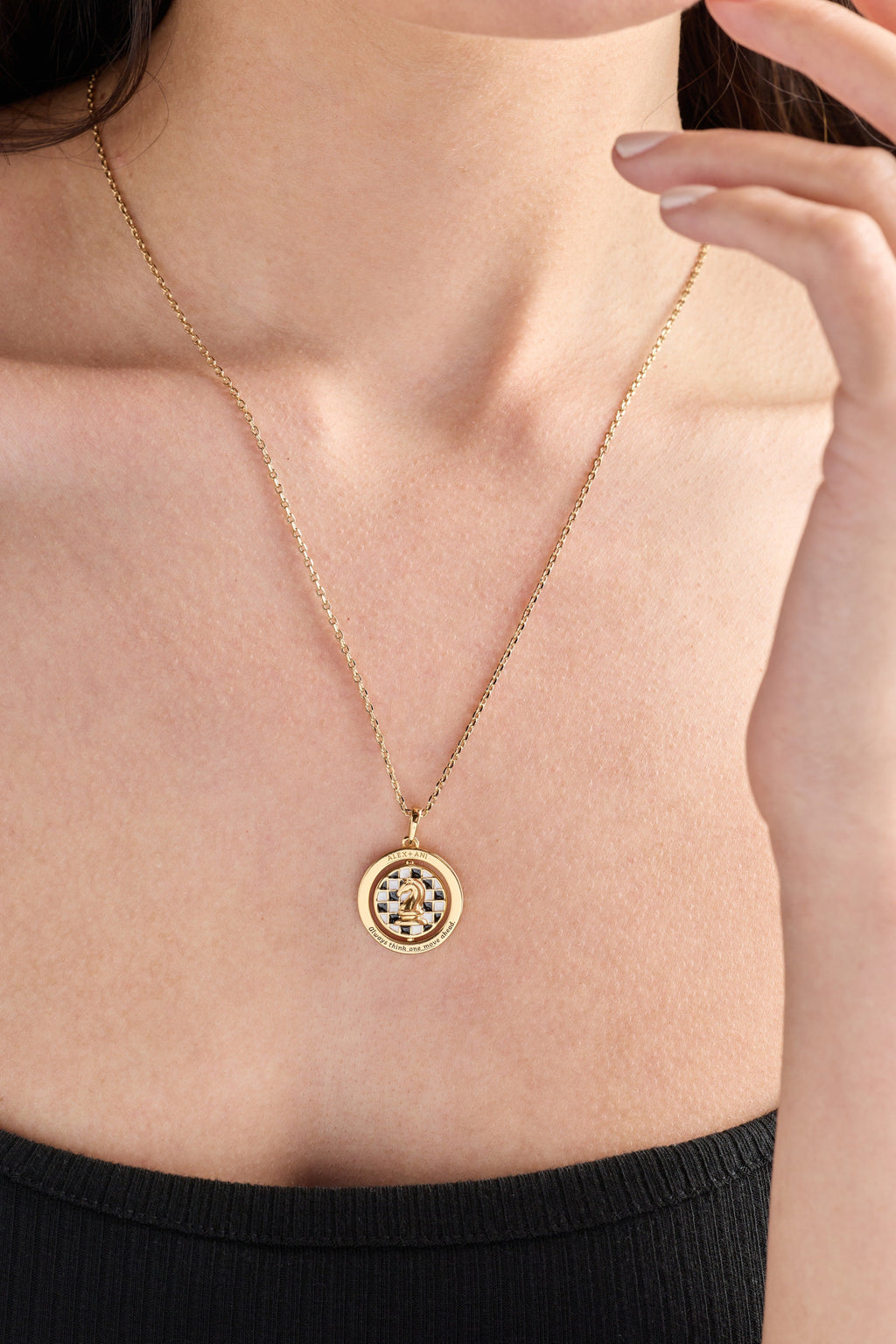 Gold chess spinner pendant necklace with round crystal halo and checkered chess center